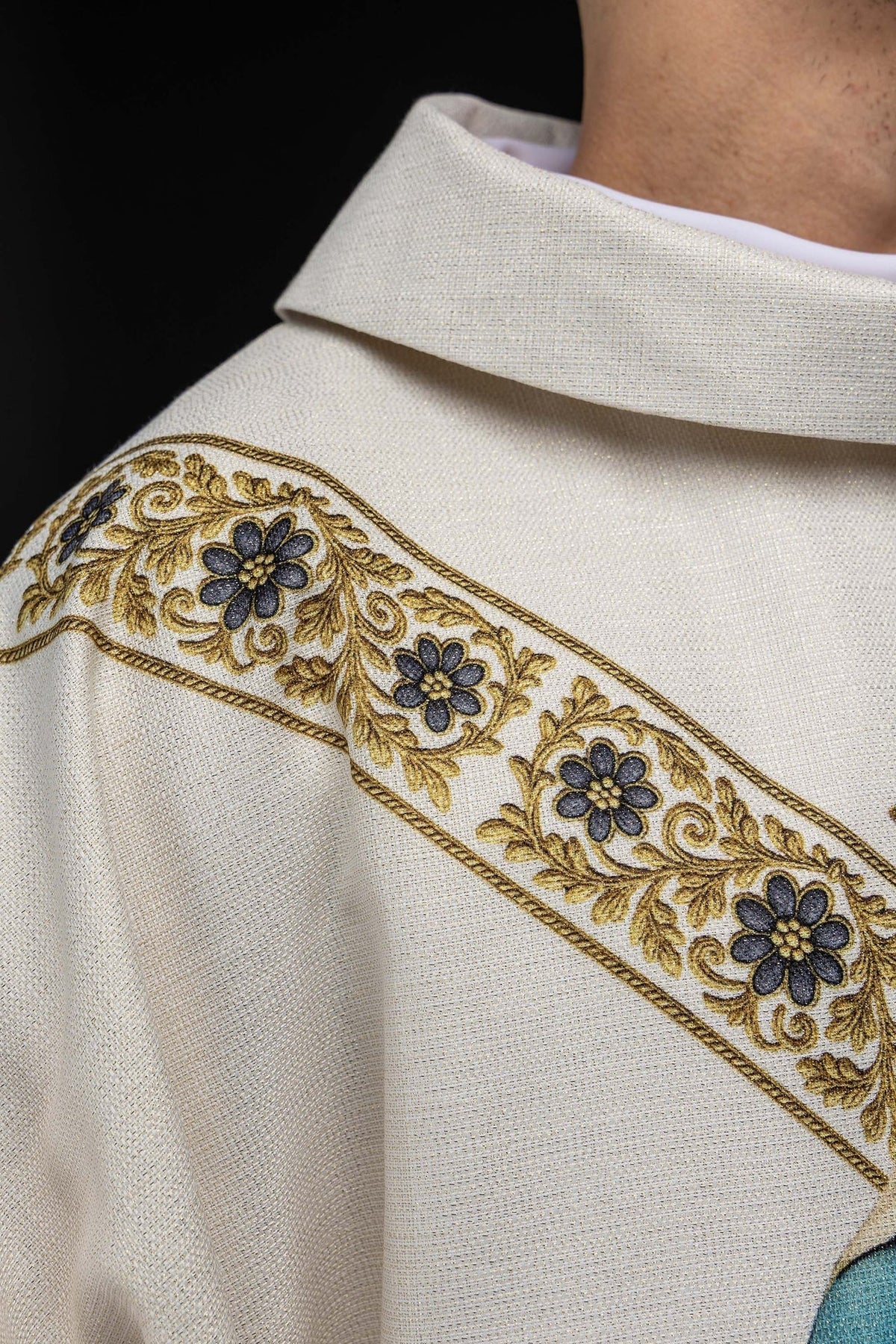 Close-up of the ecru chasuble collar and floral band