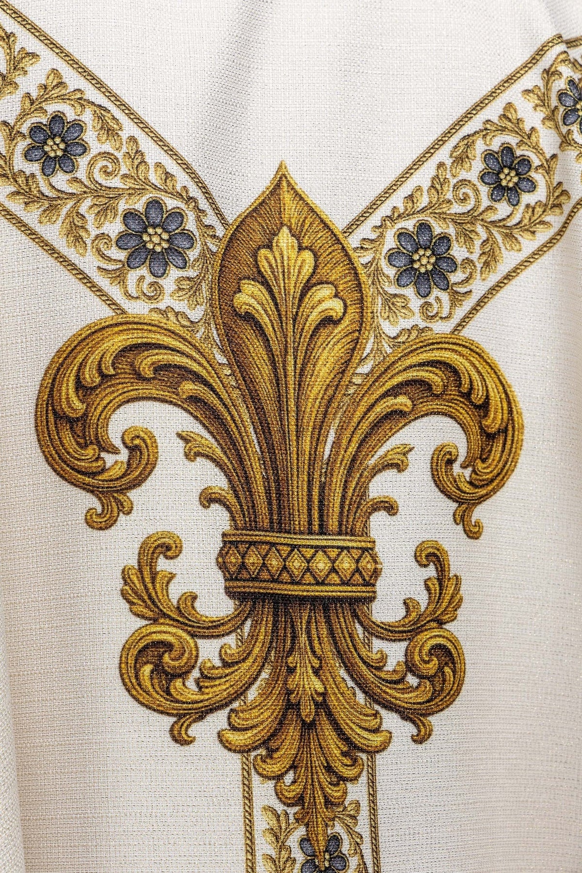 Close-up of the gold fleur-de-lis and floral band on the chasuble back