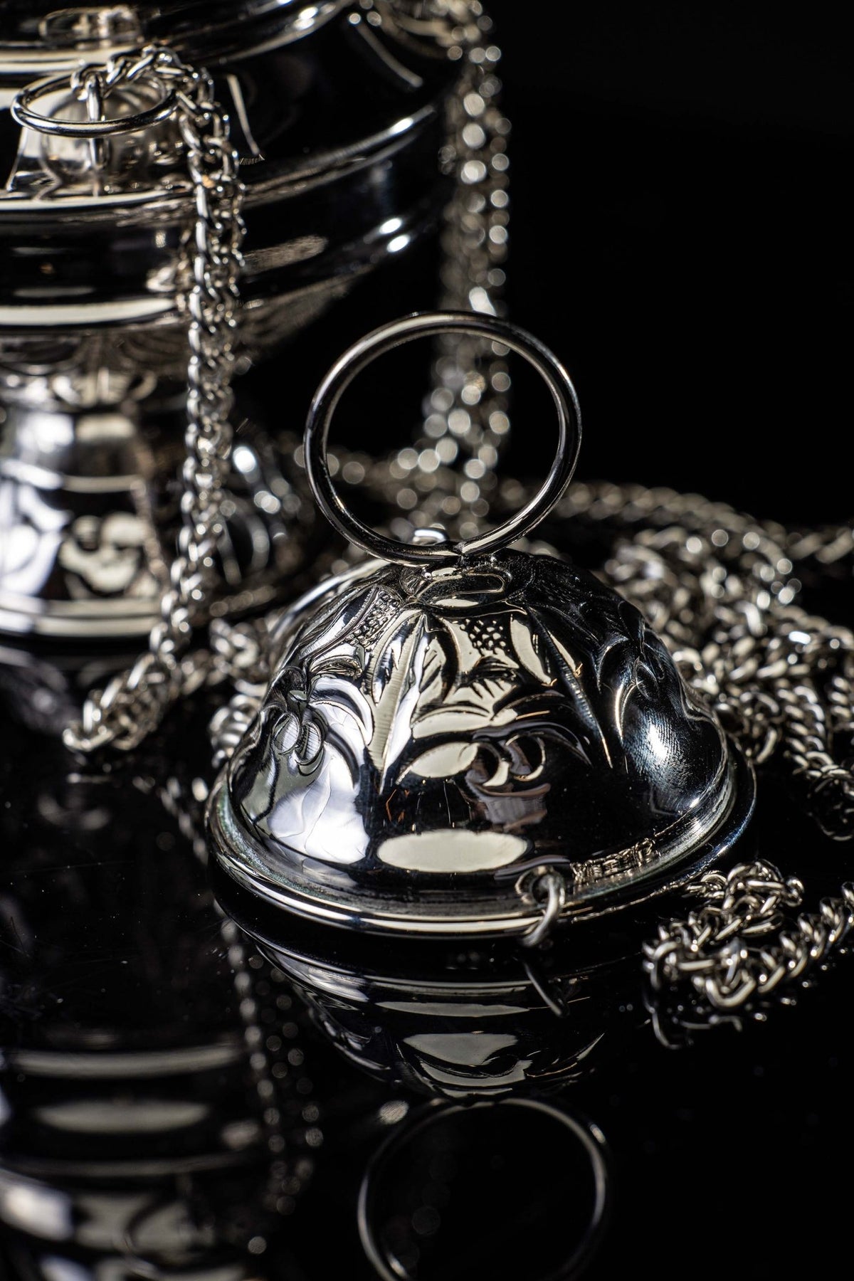 Close-up of the Santiago de Compostela thurible lid with decorative relief and ring